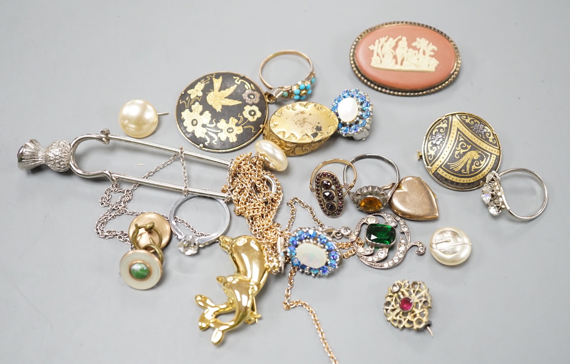 A yellow metal and turquoise cluster set dress ring(stone missing), a similar seed pearl set heart shaped locket and a group of assorted costume jewellery.